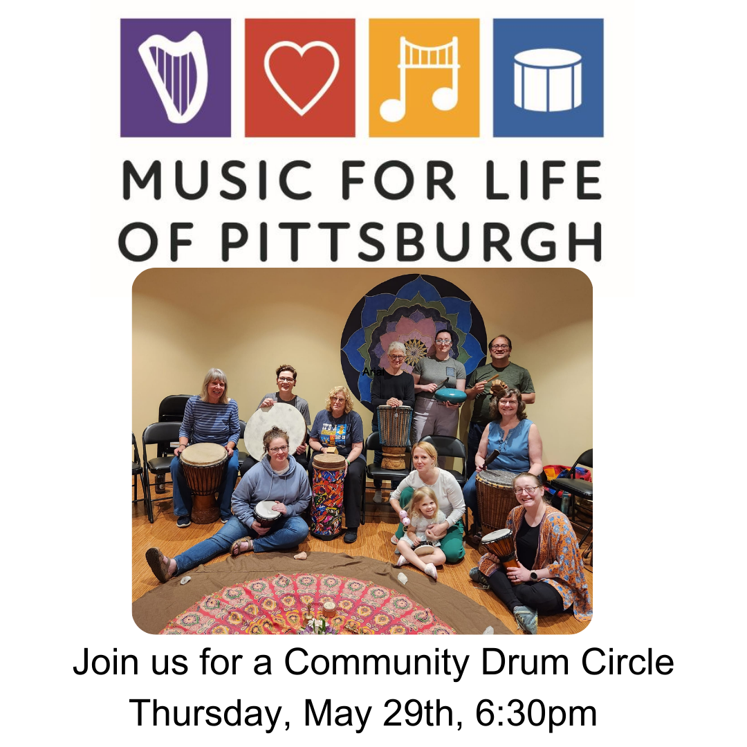 A group of people holding drums