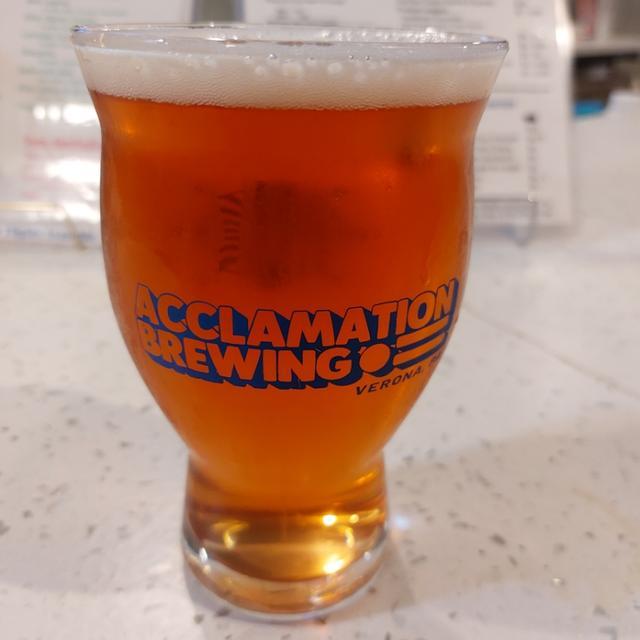 Acclamation Brewing glass filled local brew